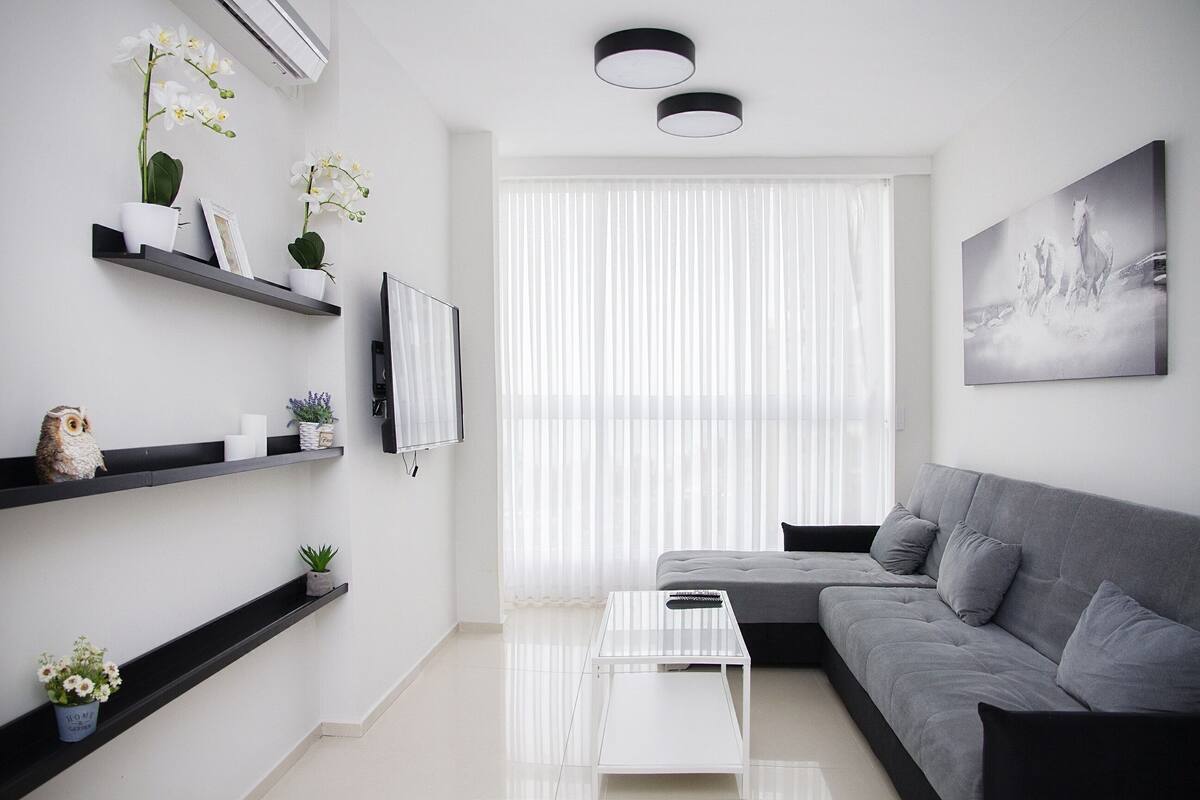 Comfort Apartment | Living area | Flat-screen TV