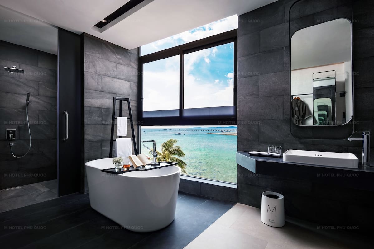 deluxe double suite | bathroom | designer toiletries, hair dryer, bathrobes, slippers