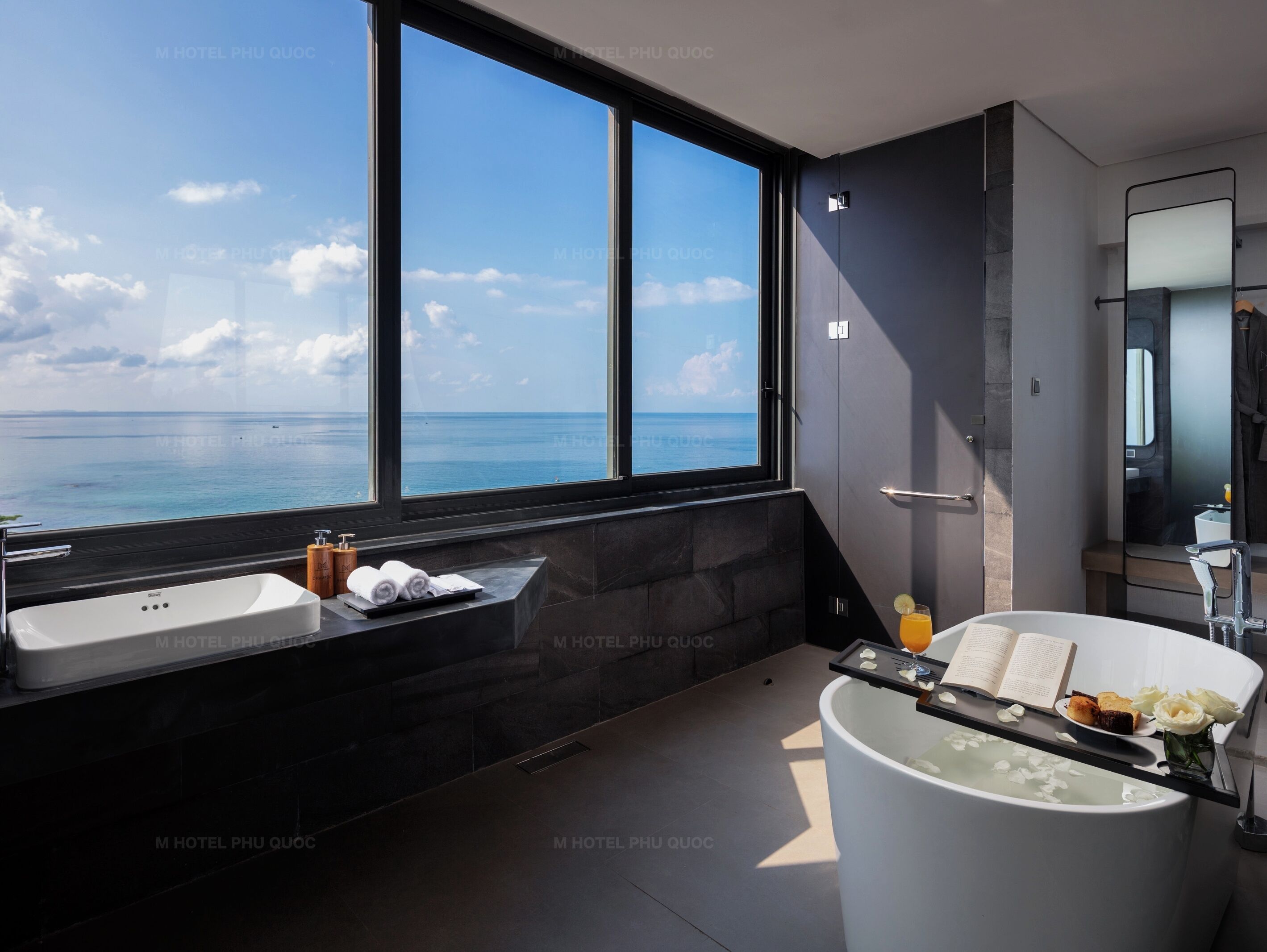 rooftop partial seaview suite | bathroom | designer toiletries, hair dryer, bathrobes, slippers