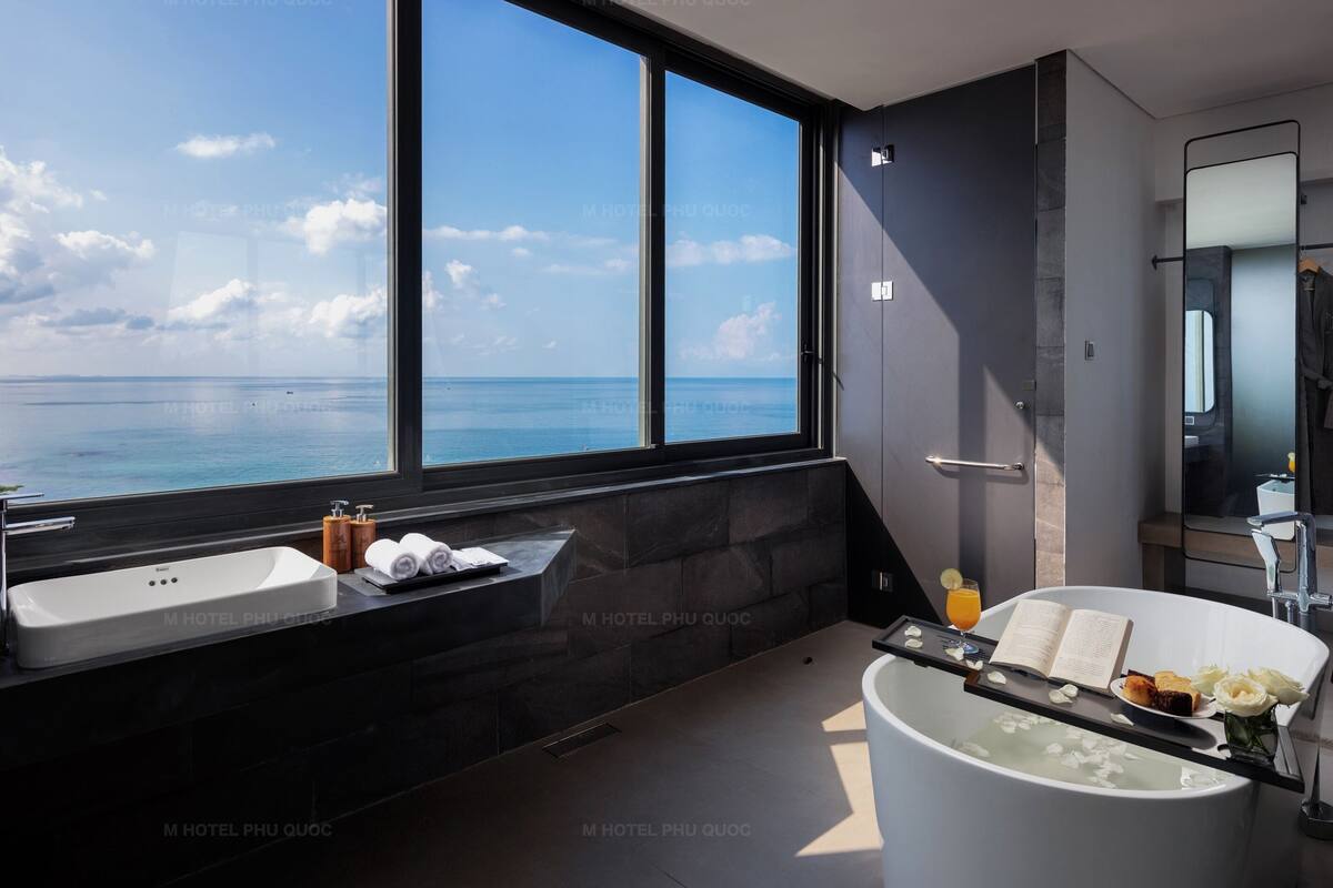 rooftop partial seaview suite | bathroom | designer toiletries, hair dryer, bathrobes, slippers