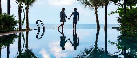 Outdoor pool, open 7:00 AM to 7:00 PM, pool umbrellas, pool loungers