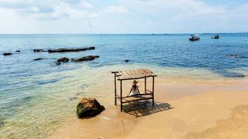 On the beach, white sand
