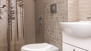 A bathroom with a shower, toilet, and sink.