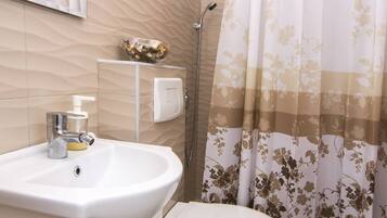 Shower, free toiletries, hair dryer, towels