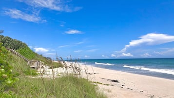 On the beach, sun loungers, beach towels