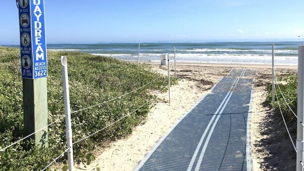 A beach access sign with rules and beach access number. - Sun Ray #2B - Pet Friendly, 3min Walk to Beach (South Padre Island)