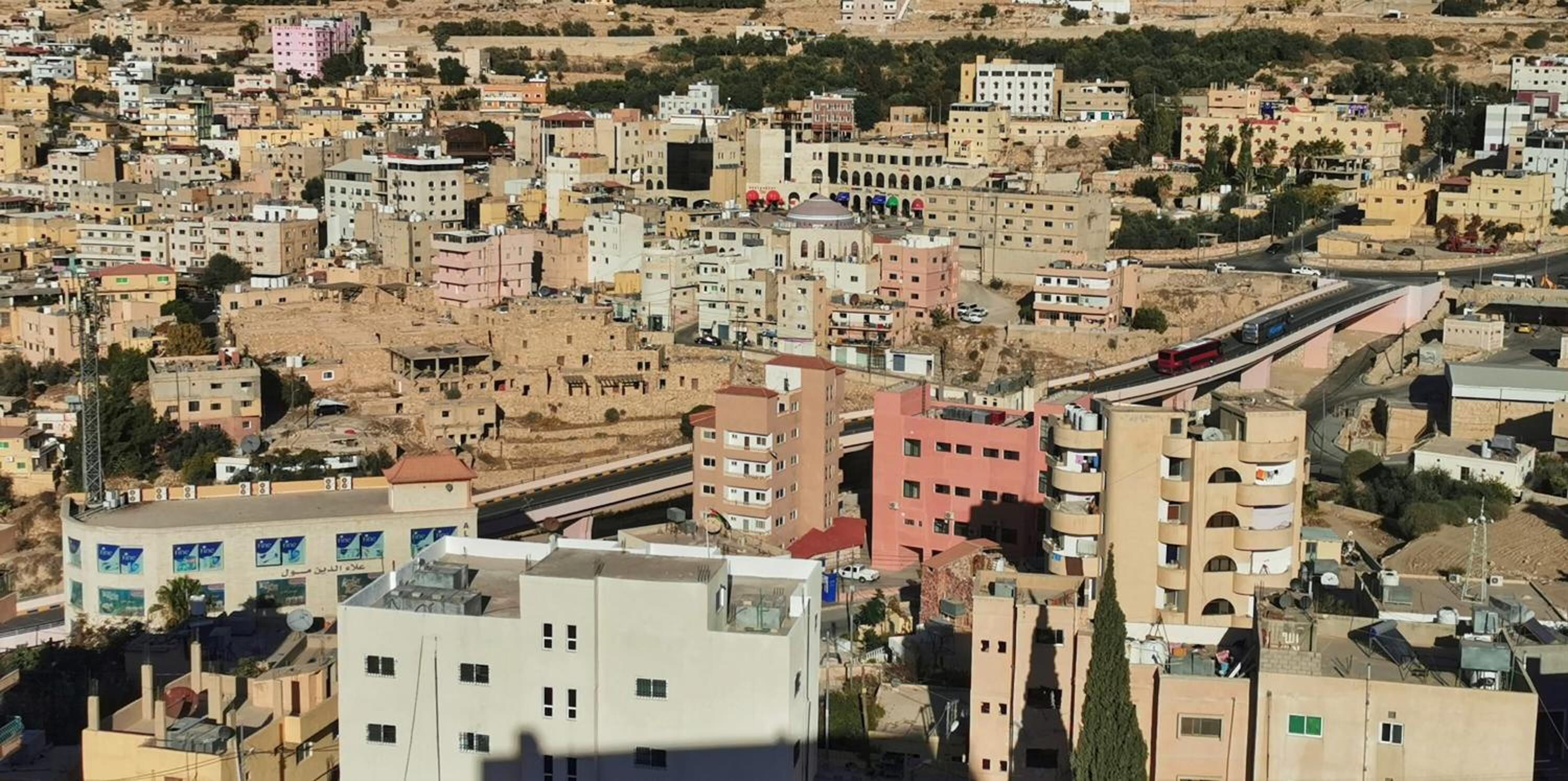 A densely packed urban area with various buildings, including residential and commercial structures.
