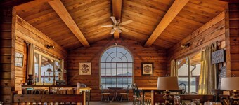 Ocean View Log Lodge with queen bed. Hot breakfast included.