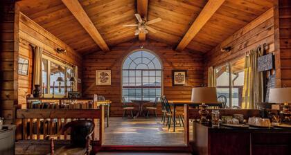 Ocean View Log Lodge with queen bed. Hot breakfast included.