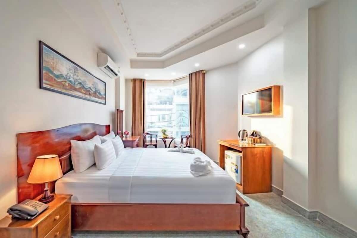 Minibar, desk, blackout curtains, iron/ironing board