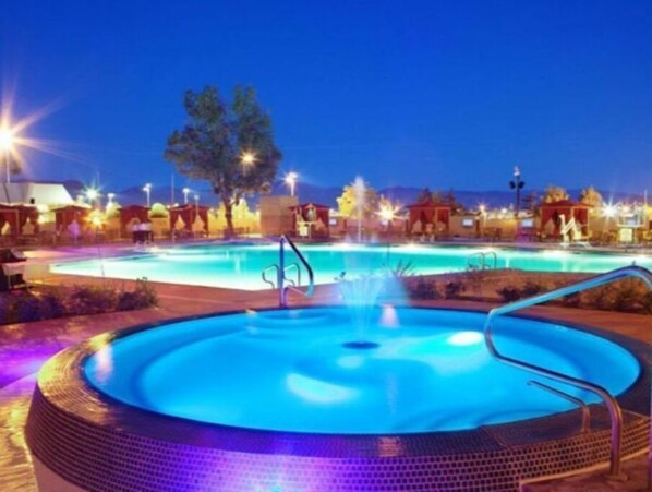 Relax by the pool surrounded by a deck.