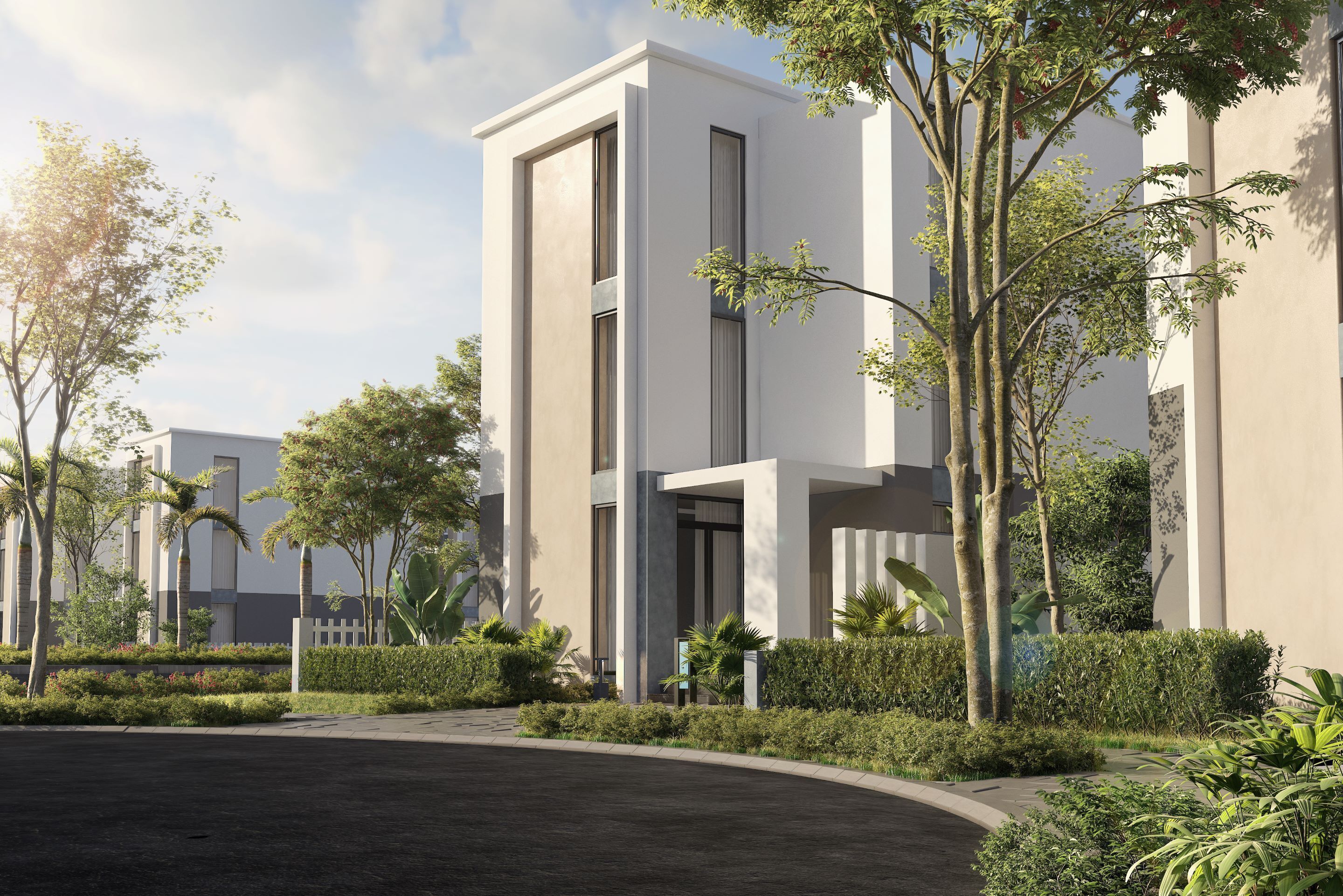 A modern building with a clean, minimalist design, featuring large windows and a well-maintained garden area.
