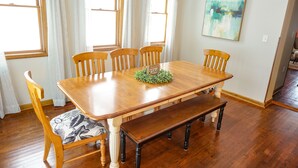 A dining room with a wooden table, six chairs, and a bench. - Blocks to Downtown. Charming 3 Bed, Entire House (Stillwater)