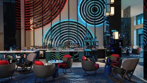 A modern bar area with a bar counter, seating, and ambient lighting. - Renaissance Nanning Hotel (Nanning)