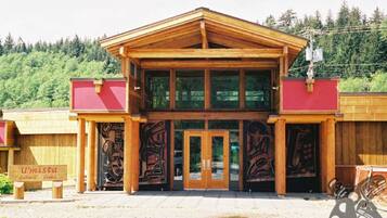 Umista Cultural Centre features a rustic entrance with glass doors and a staircase.