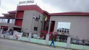 A building with a sign reading "Marian Hotels". - Marian Hotels (Calabar)