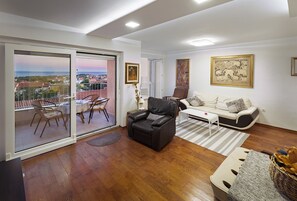Deluxe Apartment | Living room | 40-inch LCD TV with cable channels, TV, fireplace - Apartments Rosa (Krk)