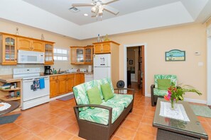 Cozy living space with a kitchenette, dining area, and comfortable seating.