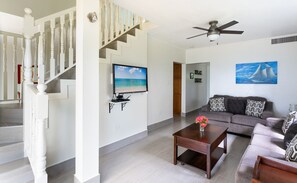 Smart TV, books - Nautilus Two – A Beachfront Condo on Seven Mile Beach - by Cayman Villas (Seven Mile Beach)