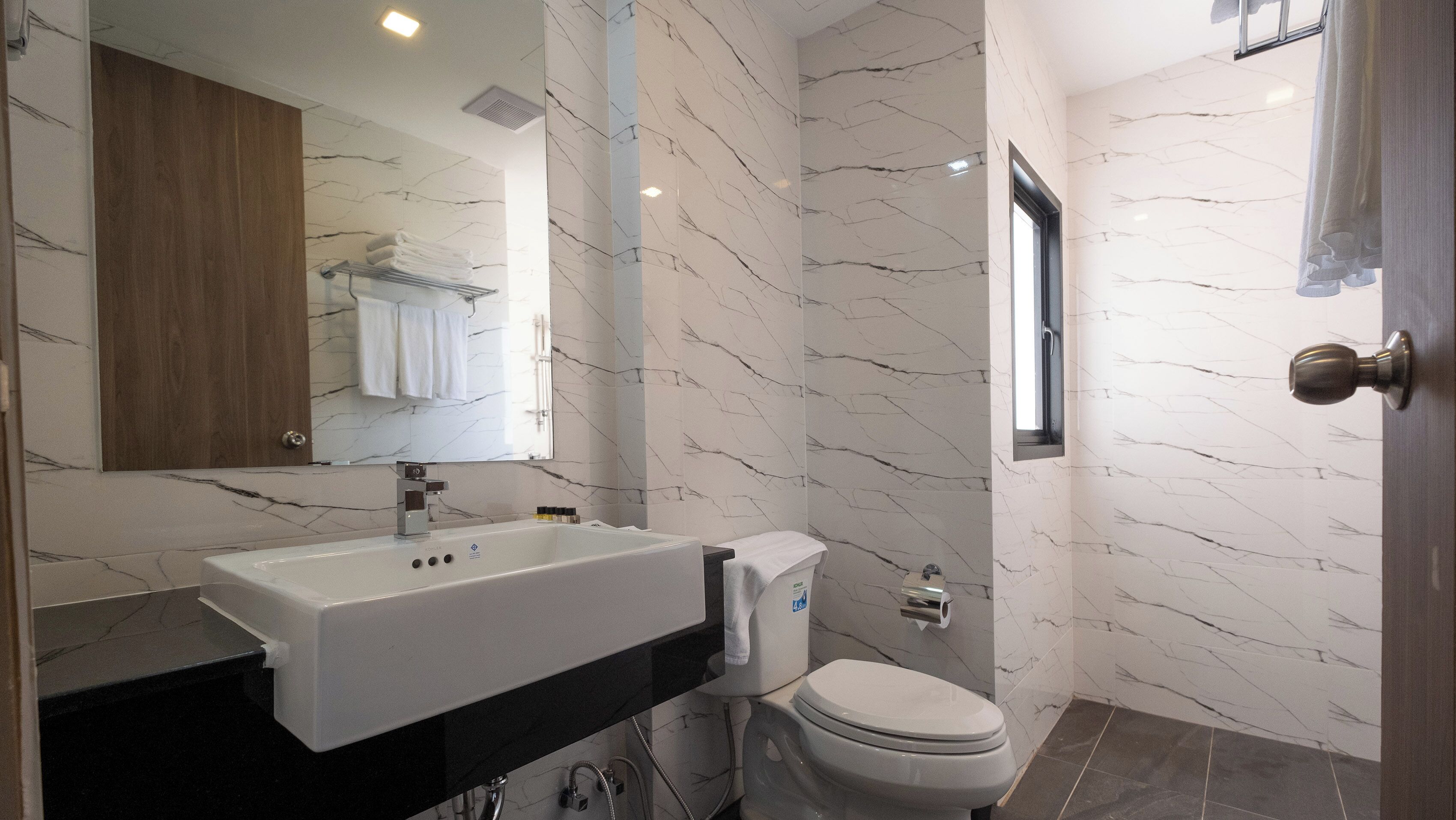 deluxe triple room | bathroom | shower, free toiletries, hair dryer, towels