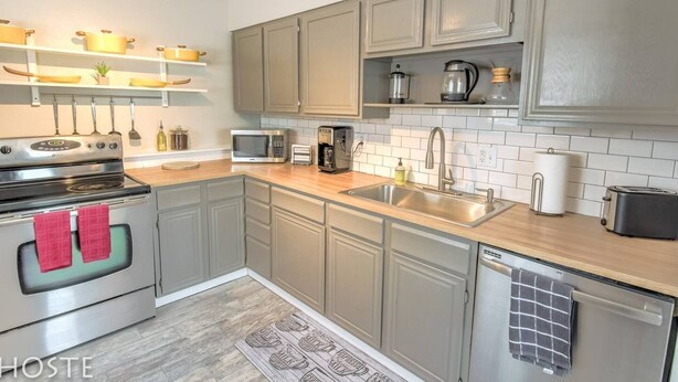 A modern kitchen with a built-in oven, microwave, and coffee maker. - 2BR Garden-level Great Outdoors Dog Friendly (Colorado Springs)