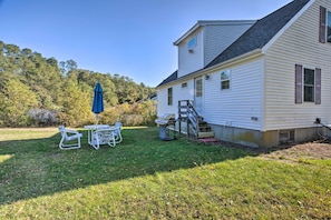 Stroll through the beautifully manicured lawn to the inviting front porch and entrance.