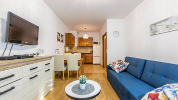 Apartamento | Sala de estar | Una televisión de pantalla plana