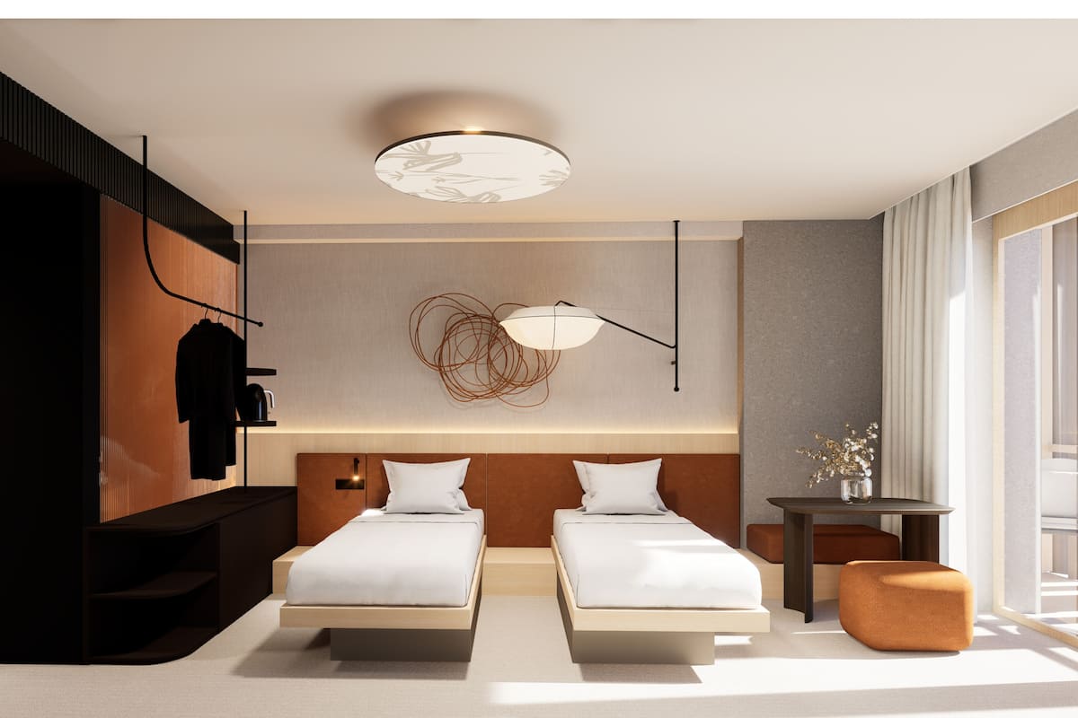 A modern hotel room with two beds, a desk, a chair, and a large window.