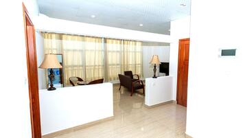 Classic Apartment | Living area | 40-inch TV with digital channels