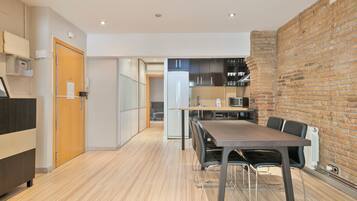 Apartment, 1 Bedroom | Living area | Flat-screen TV
