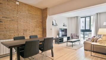 Apartment, 1 Bedroom | Living area | Flat-screen TV