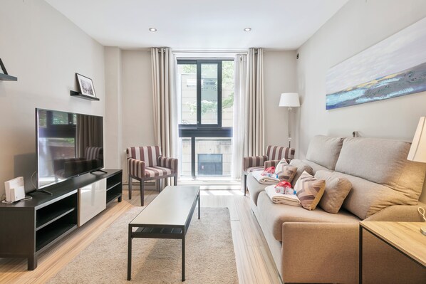 Apartment, 1 Bedroom | Living area | Flat-screen TV