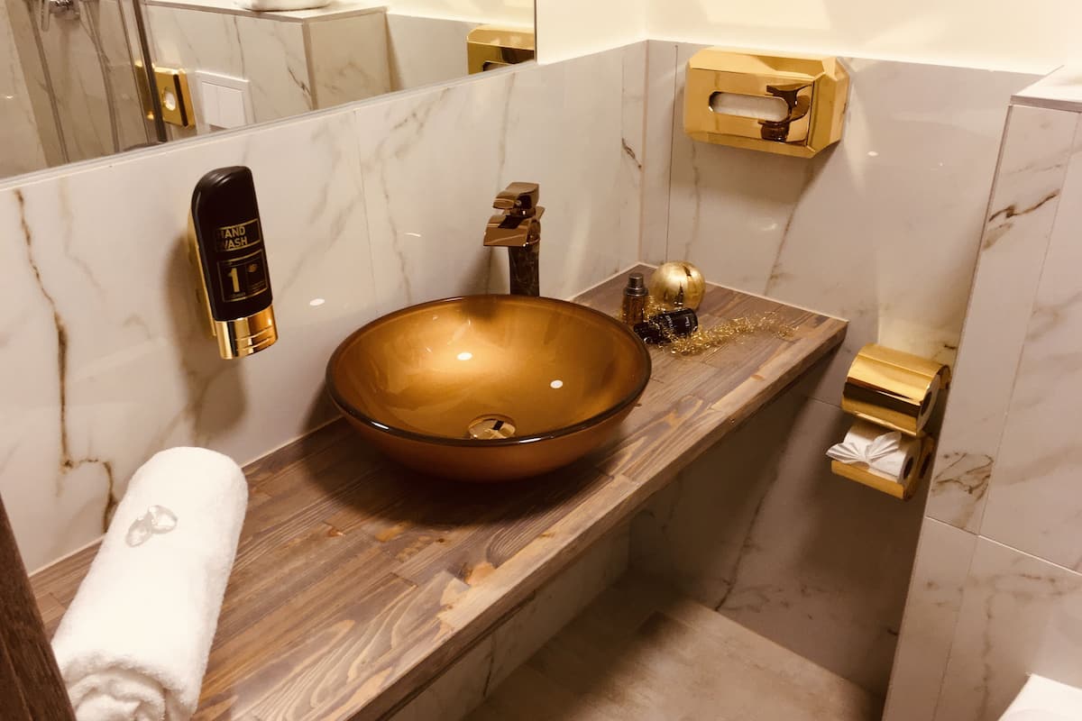 single room | bathroom | shower, hair dryer, towels, soap