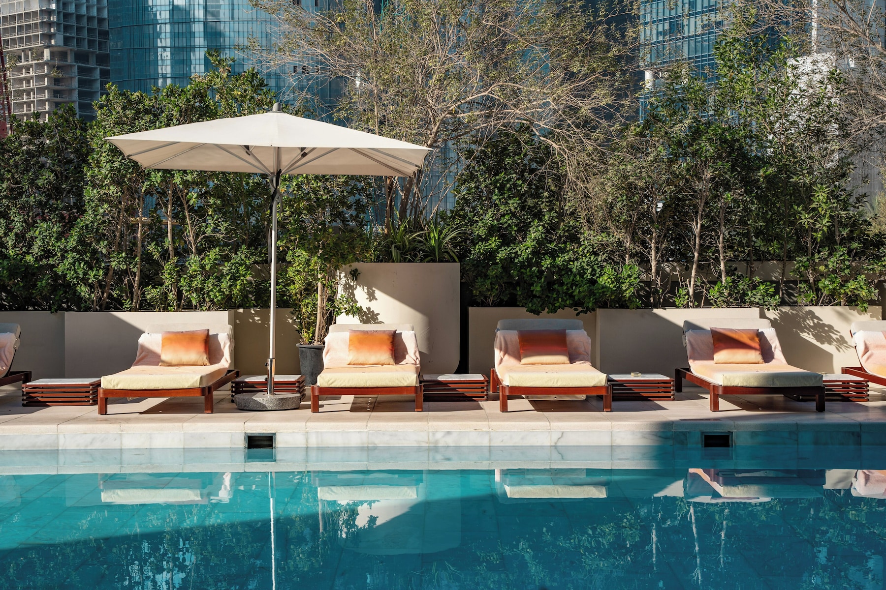 Outdoor pool, open 8:30 AM to 6:30 PM, pool umbrellas, pool loungers