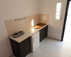 Fridge, stovetop, electric kettle, cookware/dishes/utensils