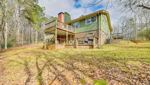 A two-story house with a balcony, a chimney, and a garage. - Creek Lodge  - LaGrange's Best Kept Secret (LaGrange)