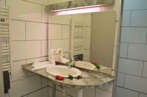 Shower, hair dryer, towels, toilet paper