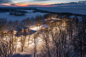 A snow-covered landscape with buildings and trees, likely a rural or countryside setting. - Saka Cliff Hotel & SPA (Saka)