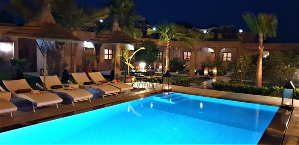 Outdoor pool, open 9:00 AM to 11:00 PM, pool umbrellas, pool loungers