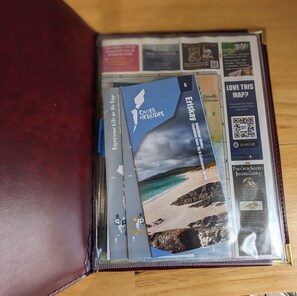 A travel brochure with a beach scene, a QR code, and a section titled "OUTER HERBRIDES". - Pod Beag Beside the Sea, Isle of Eriskay (Eriskay)