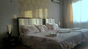 Family Triple Room | Living room | 32-inch LED TV with satellite channels, TV, video library - Stal Hotel + (Tbilisi)