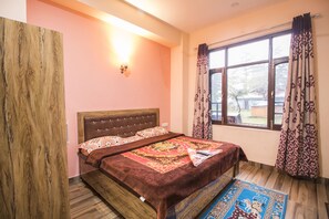 Deluxe Room | Down comforters, iron/ironing board, rollaway beds