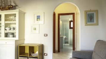 Apartamento, 1 quarto | Área de estar | TV de tela plana