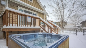 A wooden deck with a hot tub, surrounded by snow. - 3BR Hot-tub & Dog-friendly Old Colorado City!! (Colorado Springs)