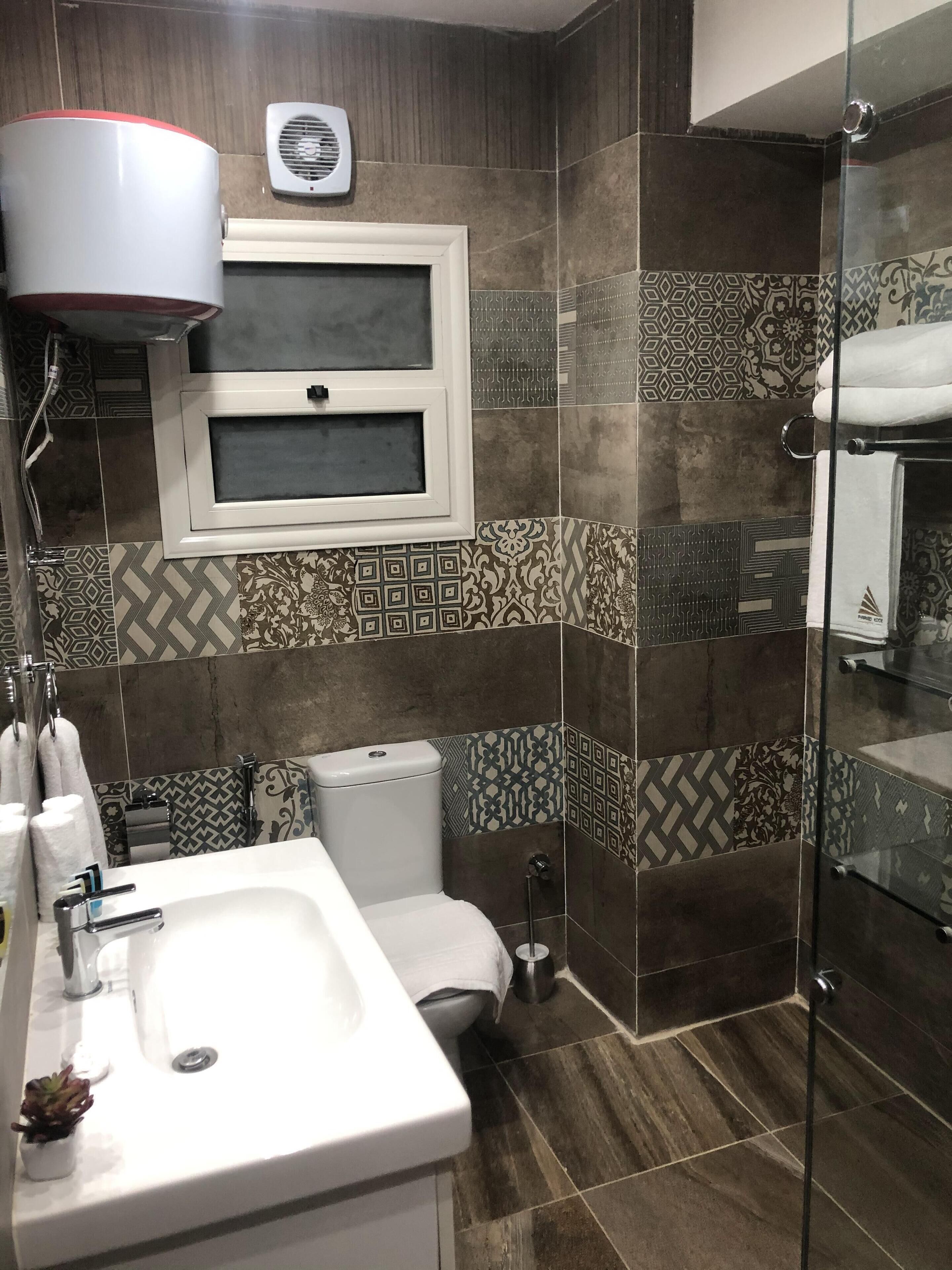 shower, rainfall showerhead, designer toiletries, hair dryer