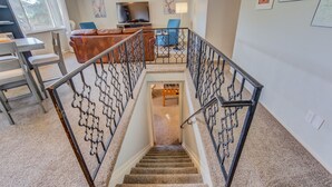 A staircase with ornate metal railings leading to a lower level. - 5BR Garden of the Gods is Across the Street! (Colorado Springs)