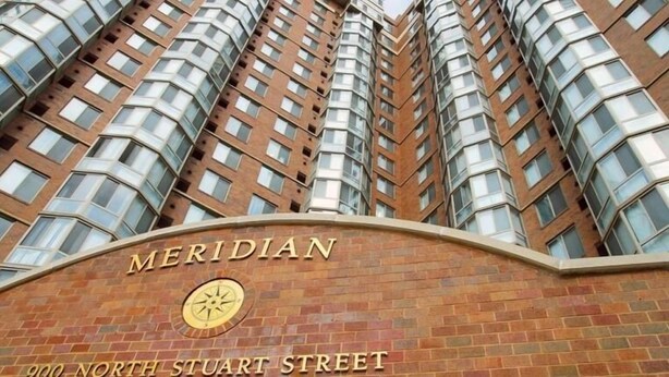 A high-rise building with a distinctive curved facade and a sign reading "MERIDIAN 900 NORTH STUART STREET". - National at Ballston Metro (Arlington)