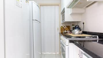 Superior Apartment | Private kitchen | Full-size fridge, microwave, cookware/dishes/utensils