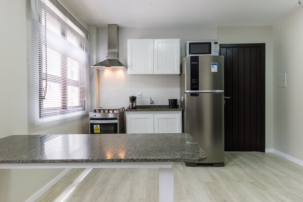 Fridge, espresso maker, cookware/dishes/utensils