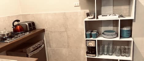 Microwave, dishwasher, coffee/tea maker, cookware/dishes/utensils